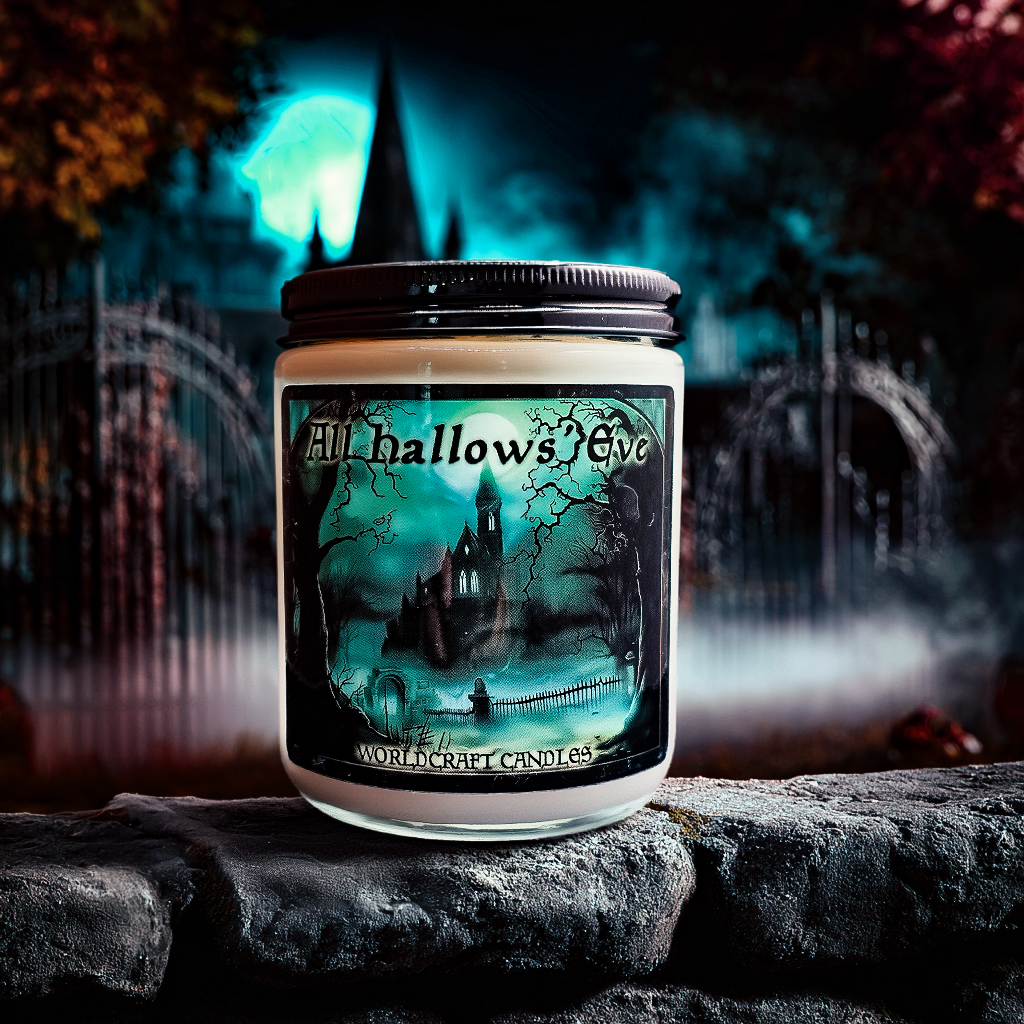 A All Hallows Eve halloween fantasy candle sitting in a spooky graveyard.